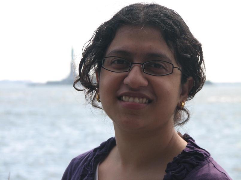 Sri smiling while looking at camera