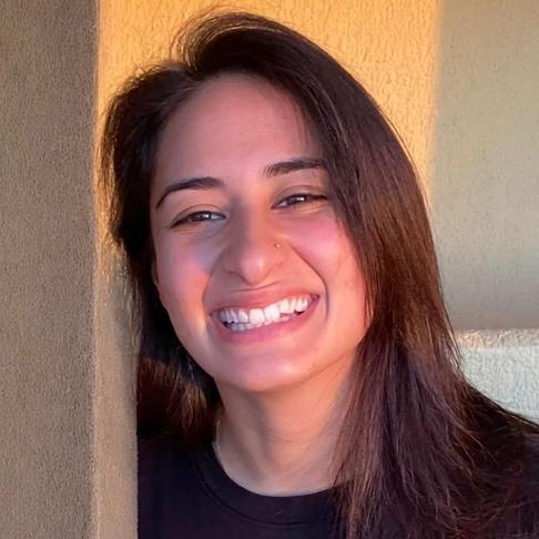 Tatiana smiling while looking at camera