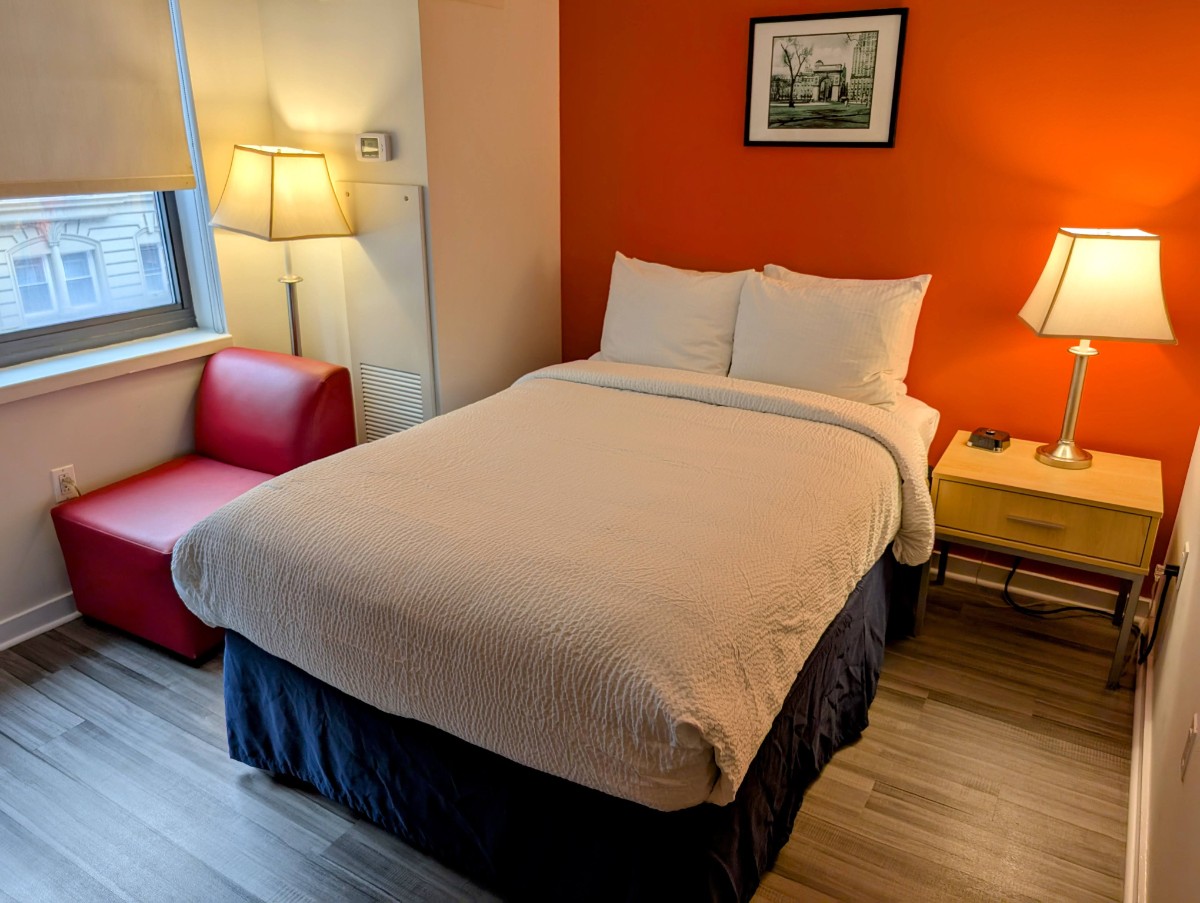 View of guest room with red accent wall