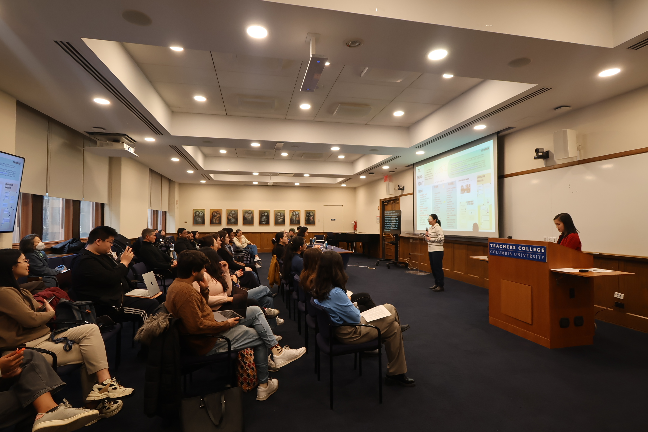 A student presenting their research in the Master's Thesis Competition