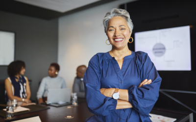 Woman with crossed arms in a boardroom
