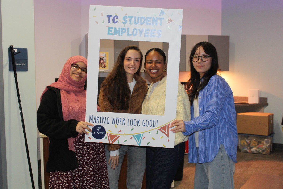TC Student employees posing with a Student Employee Appreciation Day sign