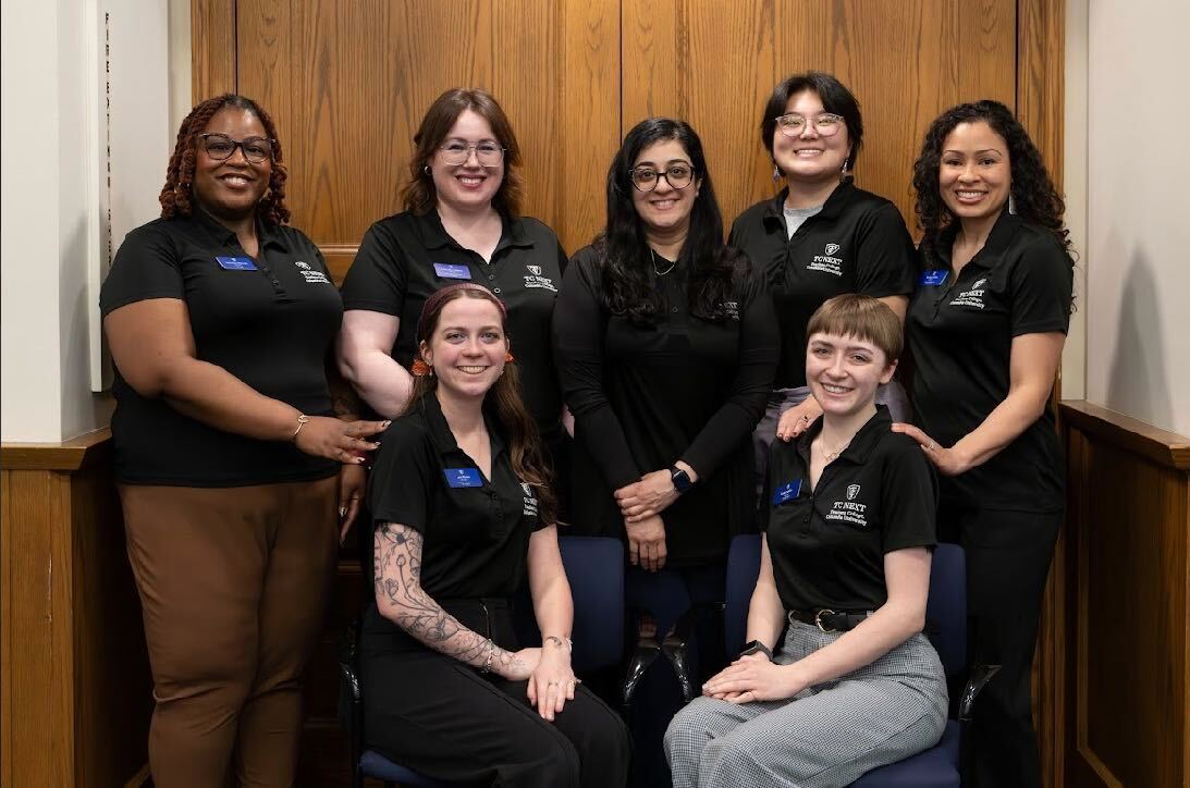 Photo of TC NEXT staff in black polos