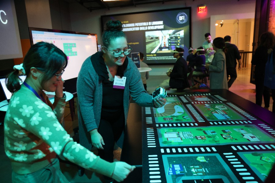 Two people engaging with an activity on a table