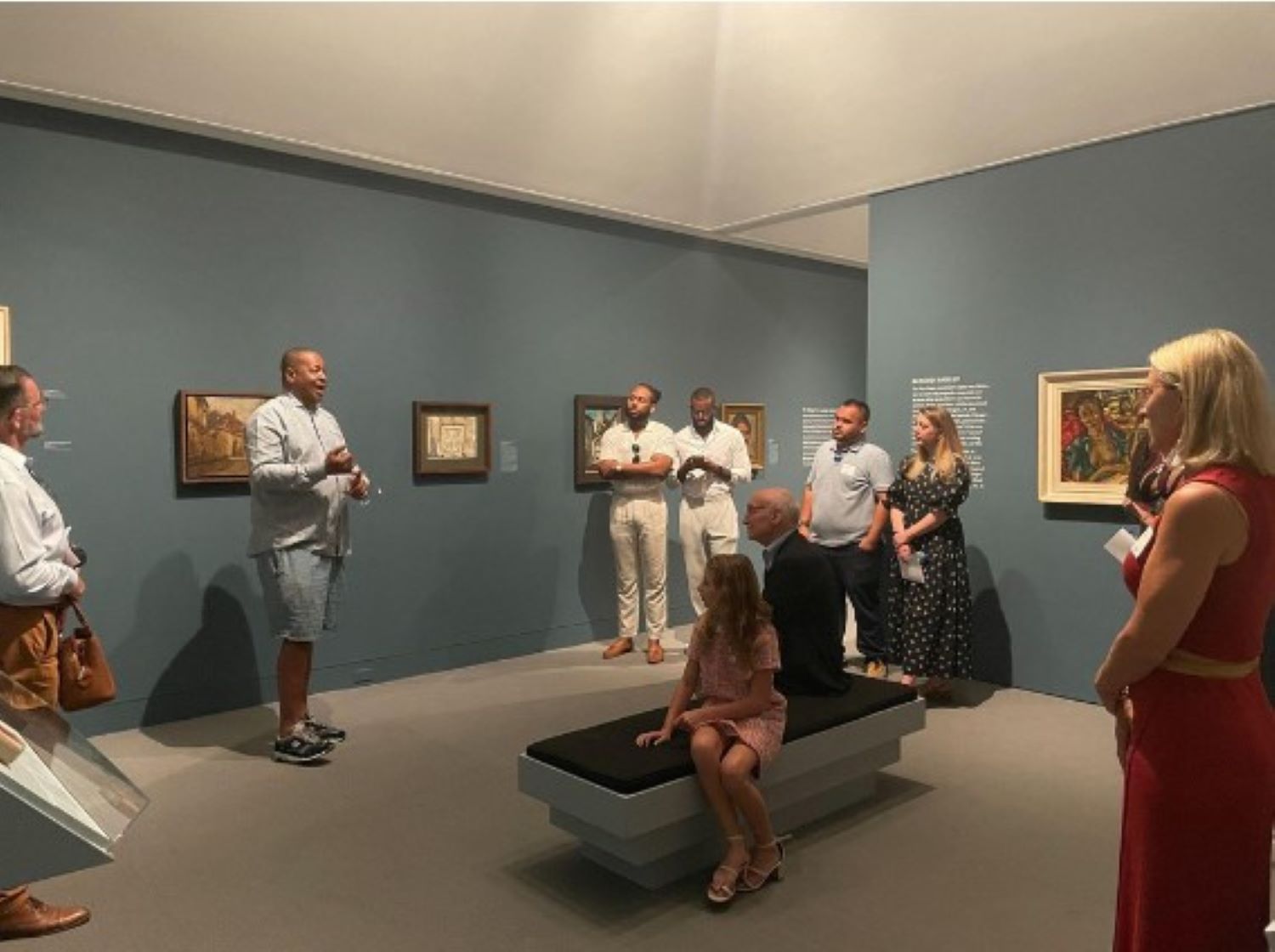 President Bailey and alumni listen to curator Chris Norward during a guided tour at the Wolfsonian Museum in Miami, Florida.