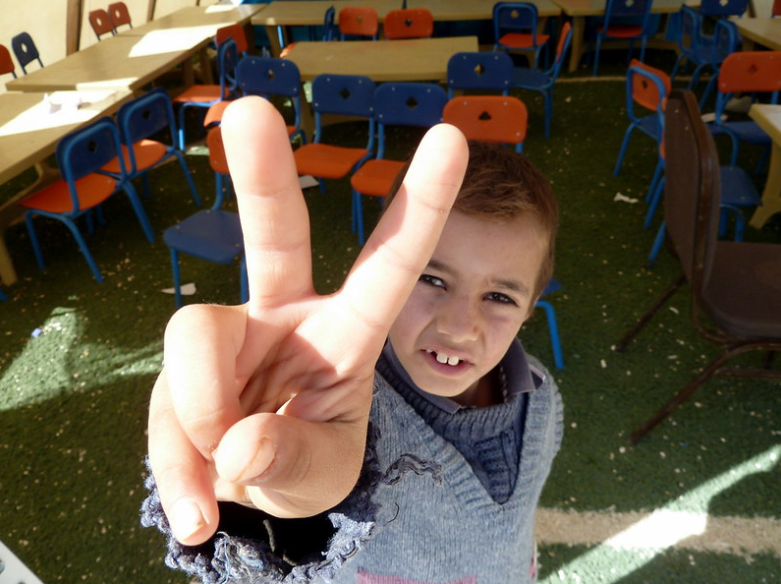 Young boy holding up 