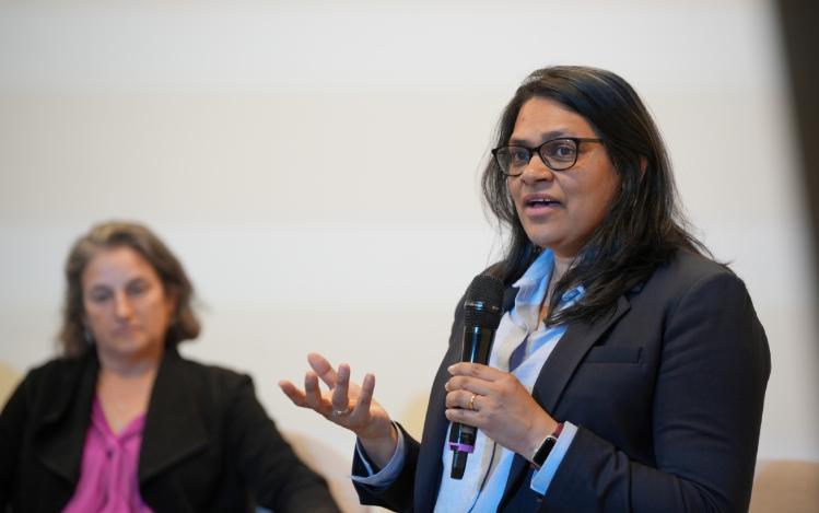 Lalitha Vasudevan talking in a panel