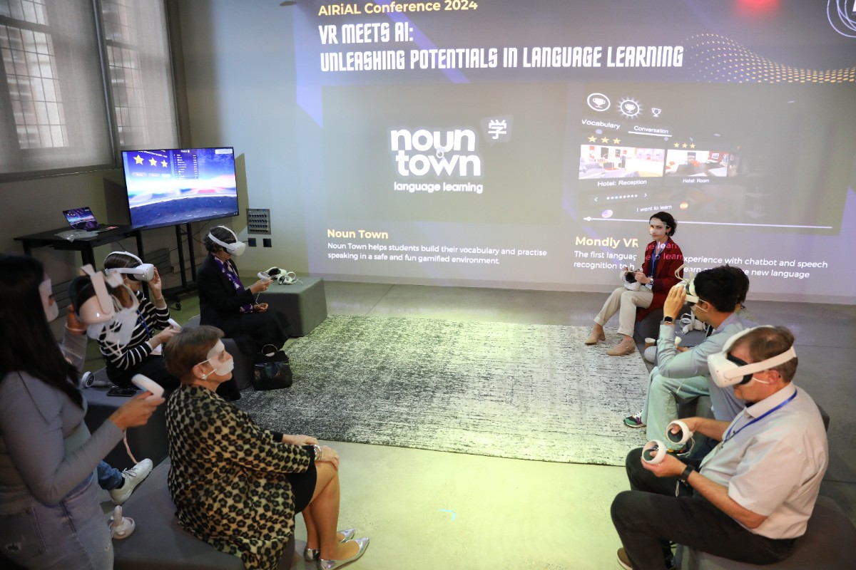 Many students sit around with VR headsets