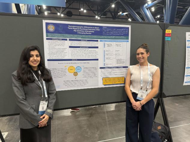 student in front of poster