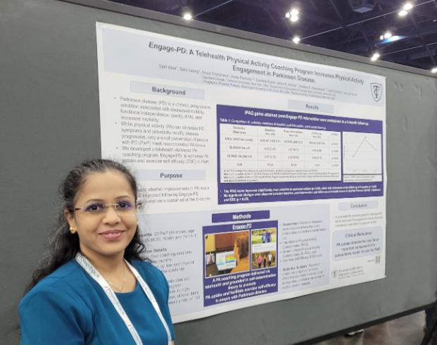 Prof in front of a poster