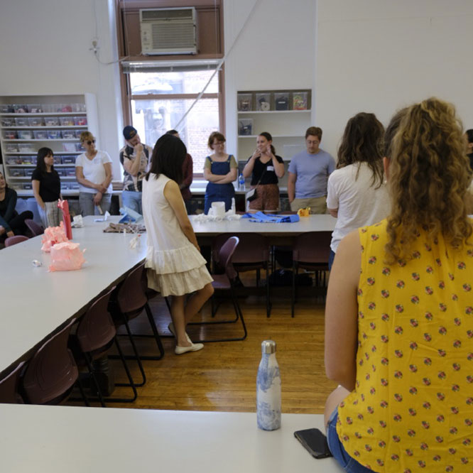 Students of the Art and Art Ed program gathering in a classroom.