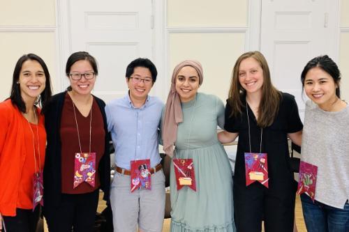 Counseling Psychology doctoral students pose with brightly colored lanyards