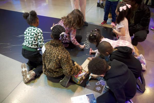 Image of students drawing on an indoor 
