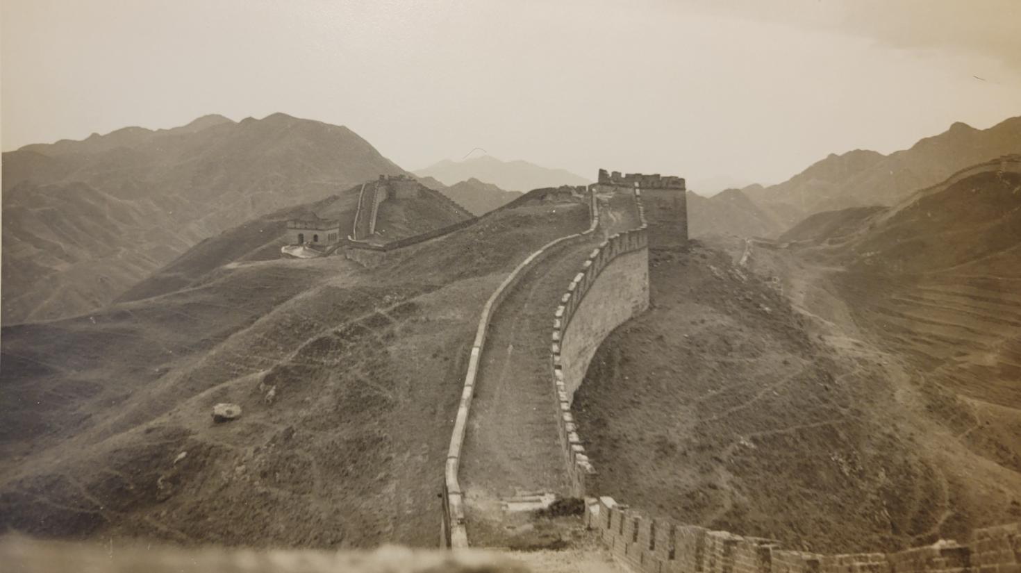 Black and white photograph depicting the great wall of China.