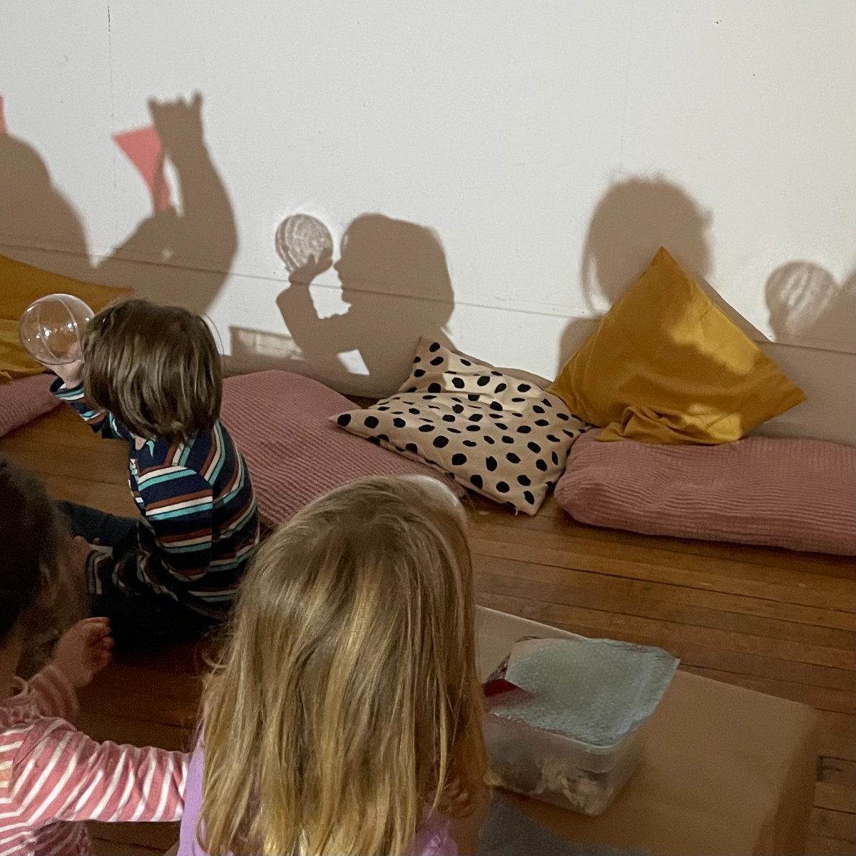 Students at play with light, exploring art-making with light in the art studio 447 near Macy Gallery