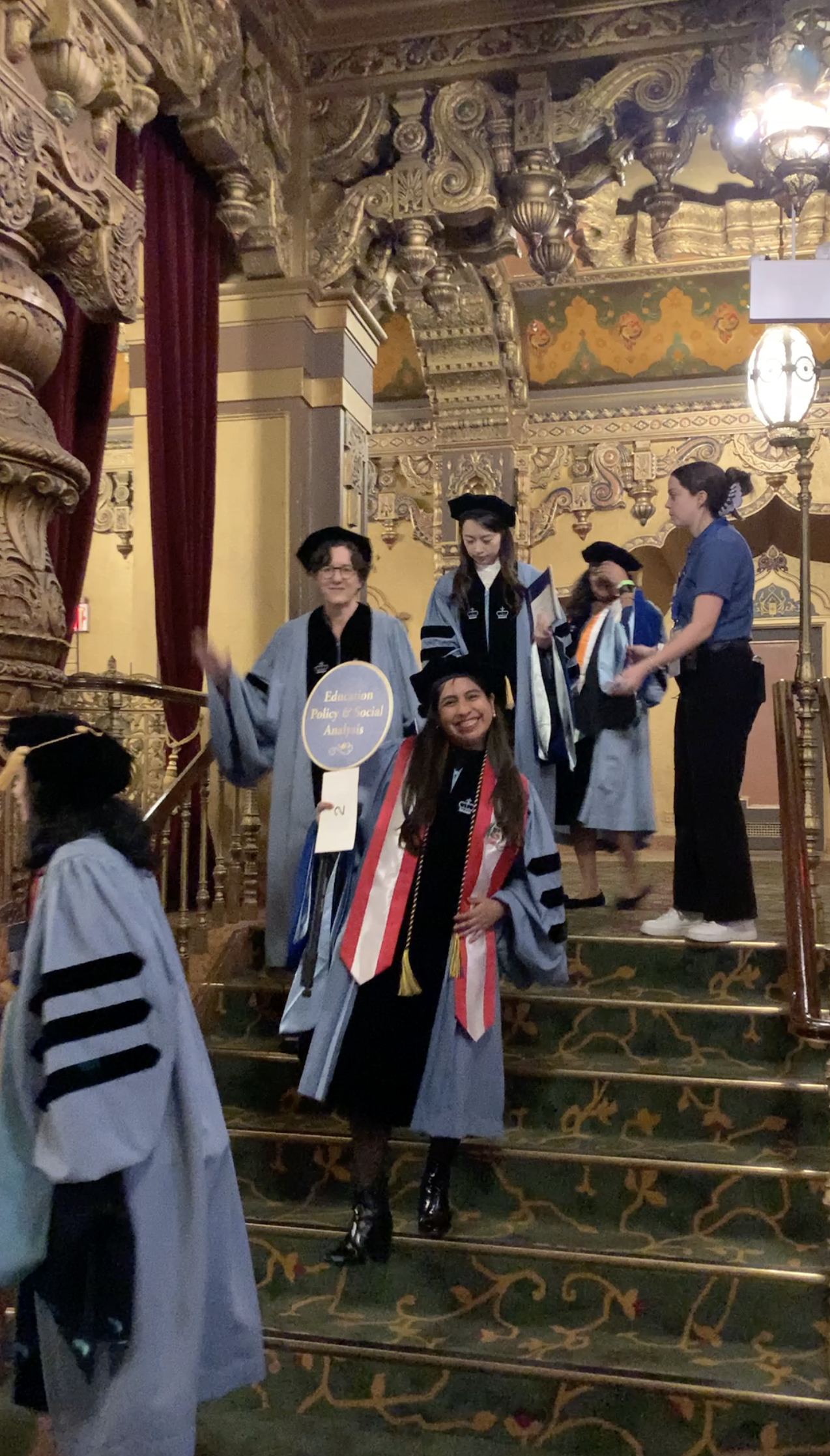 EPSA doctoral graduates walking down the stairs during procession