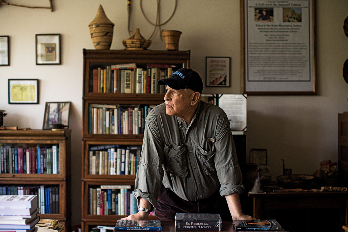 Sam Totten standing at his desk