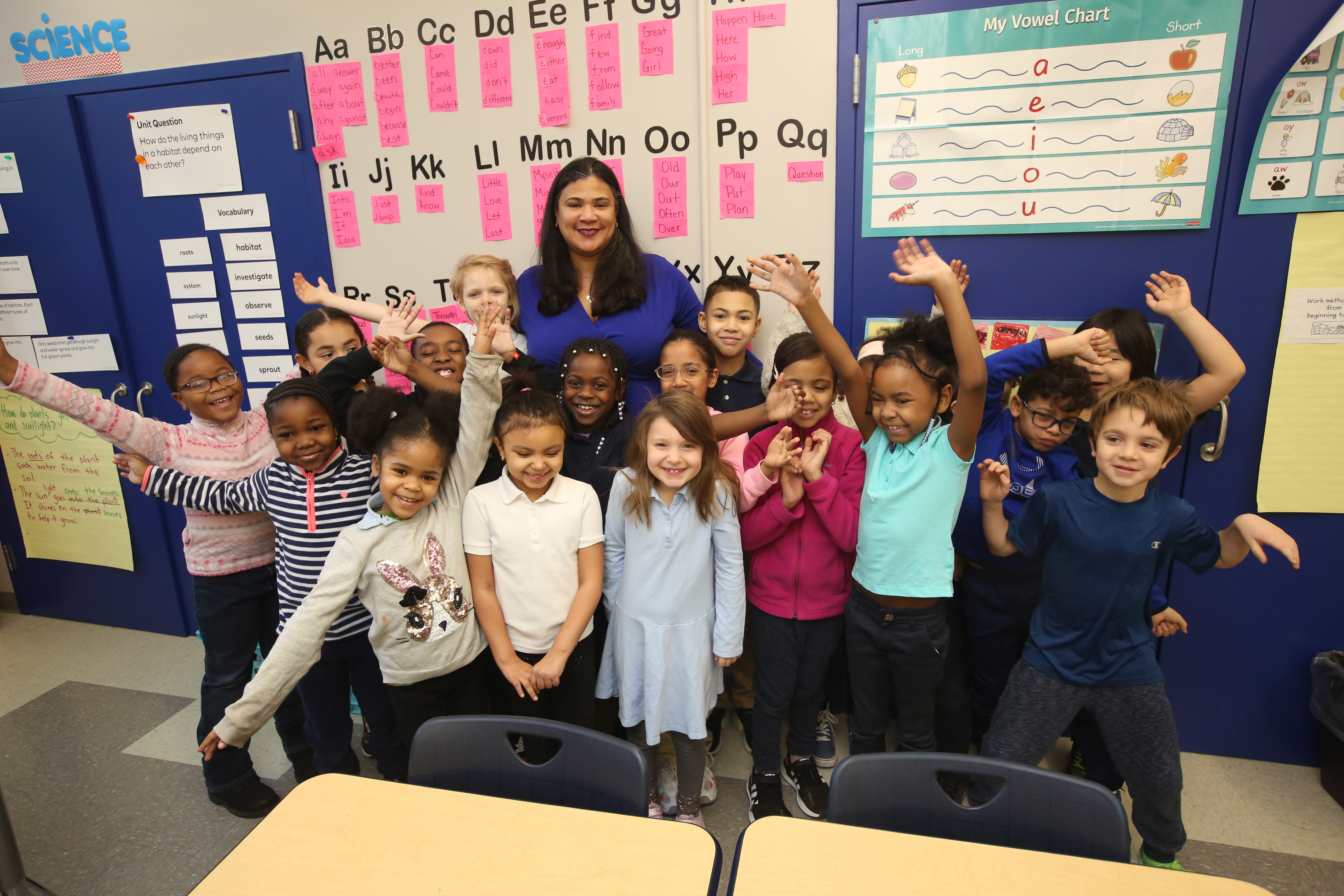 Students smiling with teacher