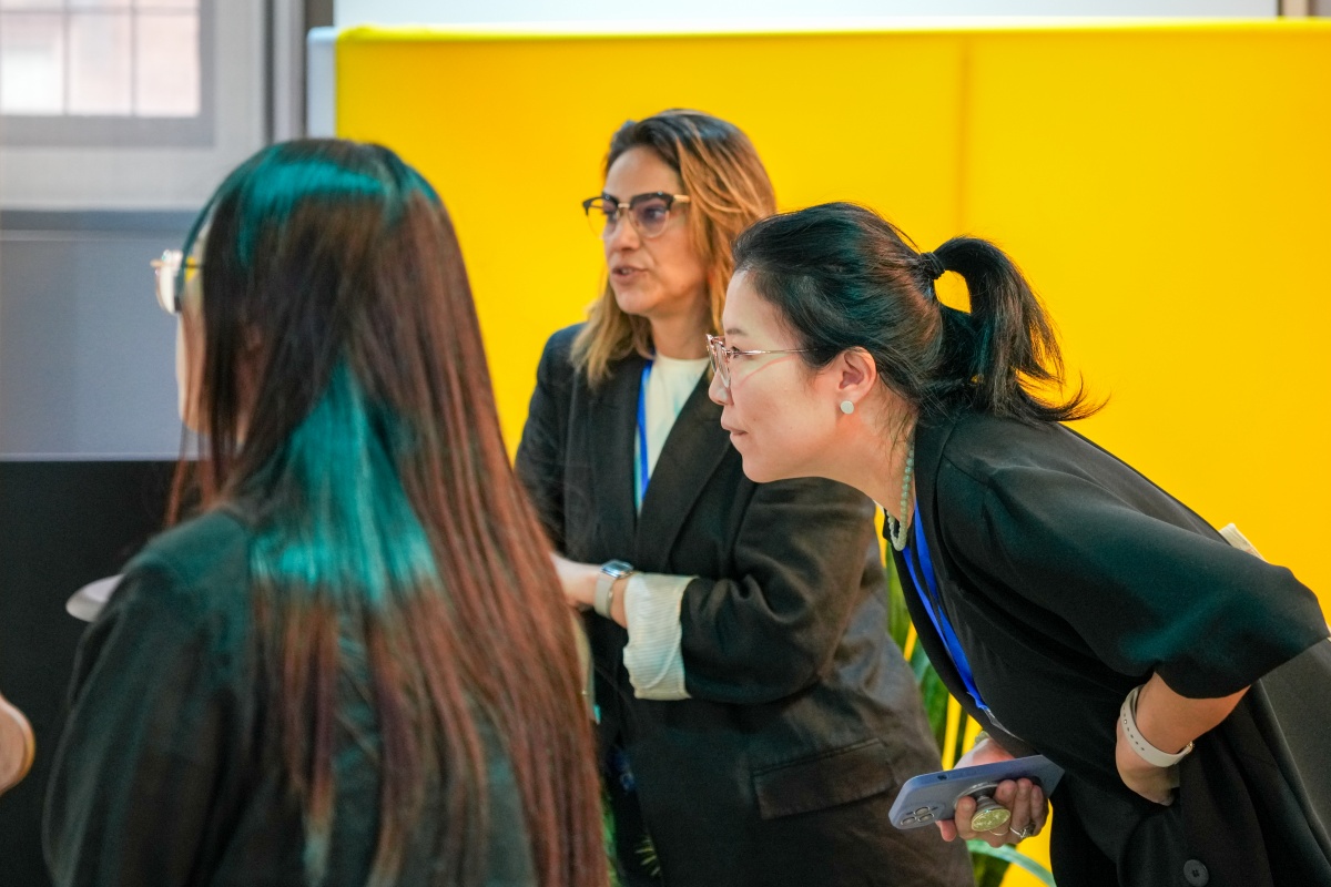 Guests discuss poster presentations during  AIRiAL 2024.