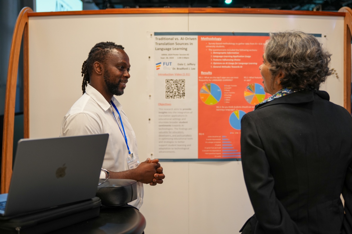 Researchers discuss poster presentations