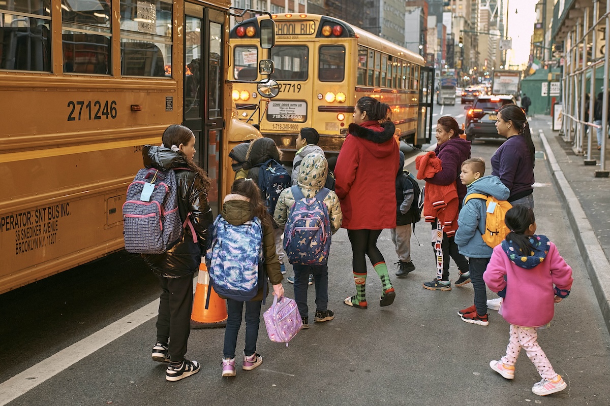 Students approach school buses in NYC