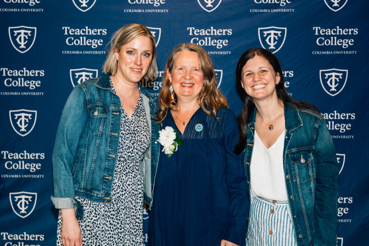 Group photo of three staff members, smiling