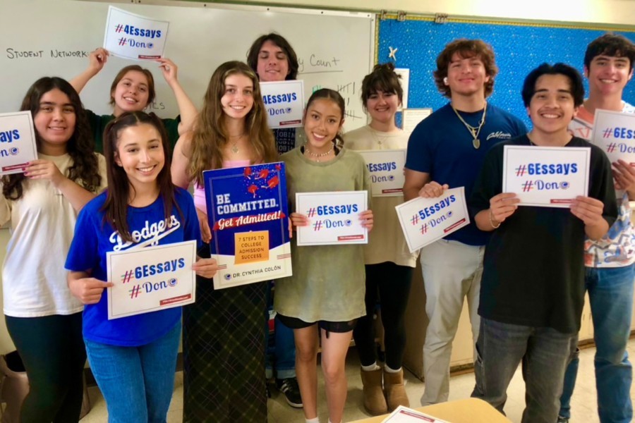 Students holding Cynthia Colon's book.