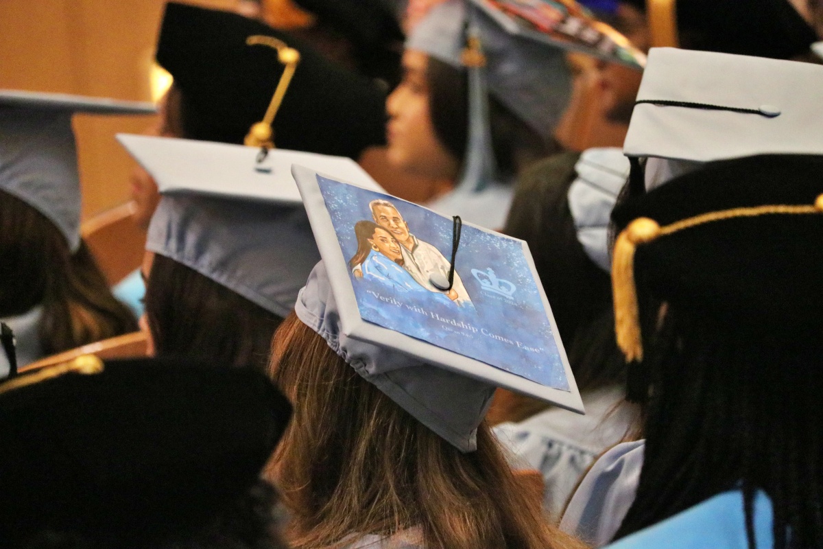 A grad cap with a family portrait