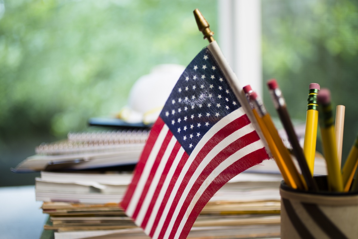 american flag in full classroom