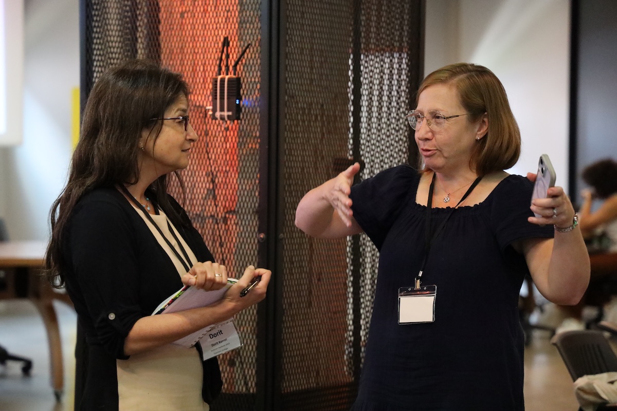 two women having an animated conversation