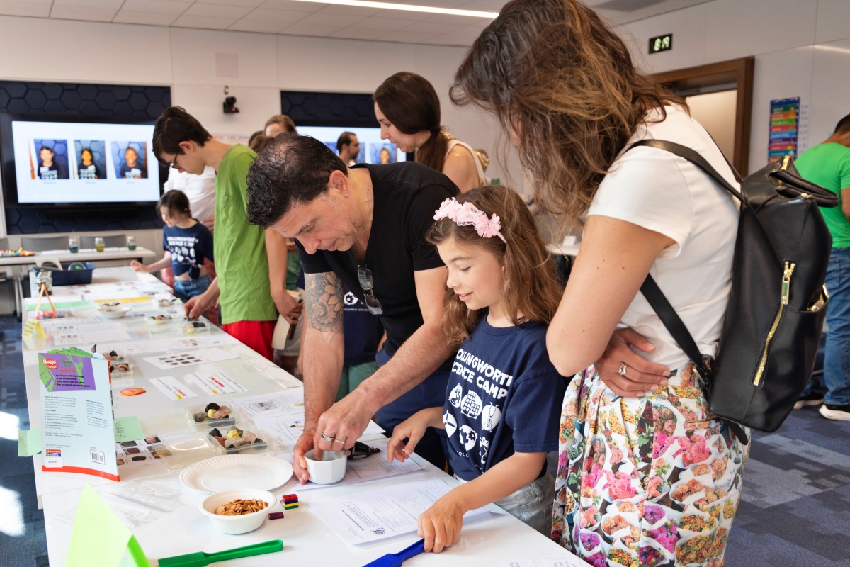 Campers show their families demos related to geology during the Hollingworth Science Camp expo.