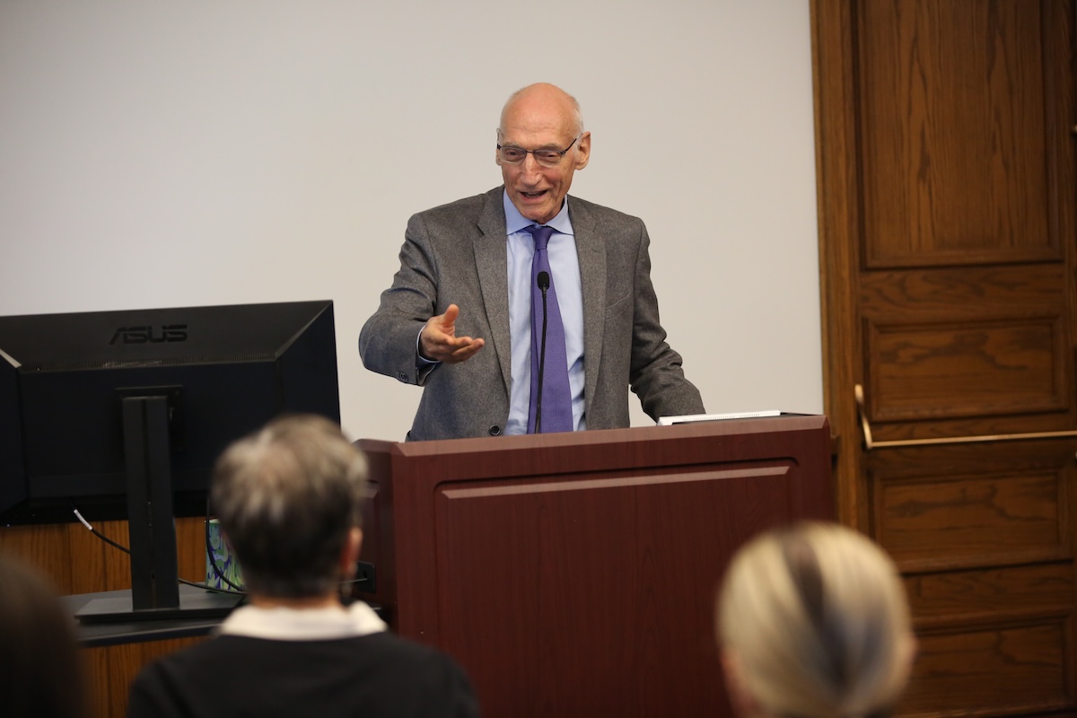 President Thomas Bailey speaks at the fireside chat with Monique Herena