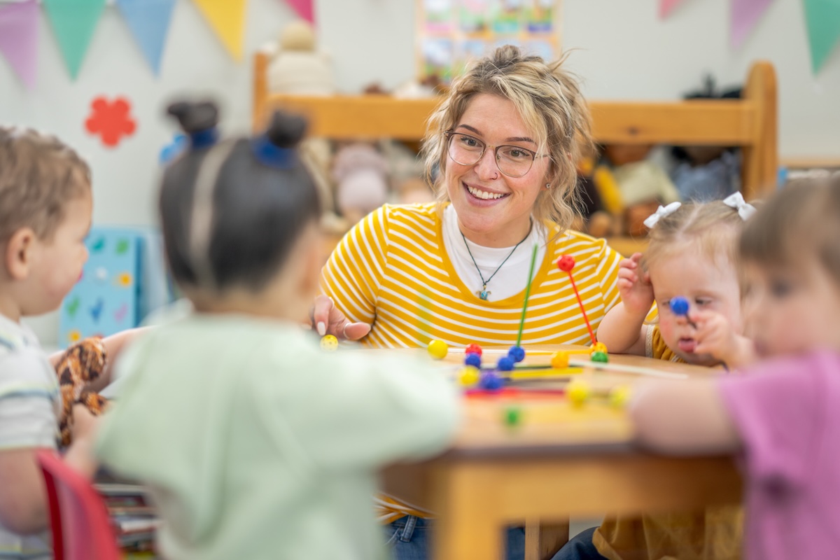 Teacher smiling with students