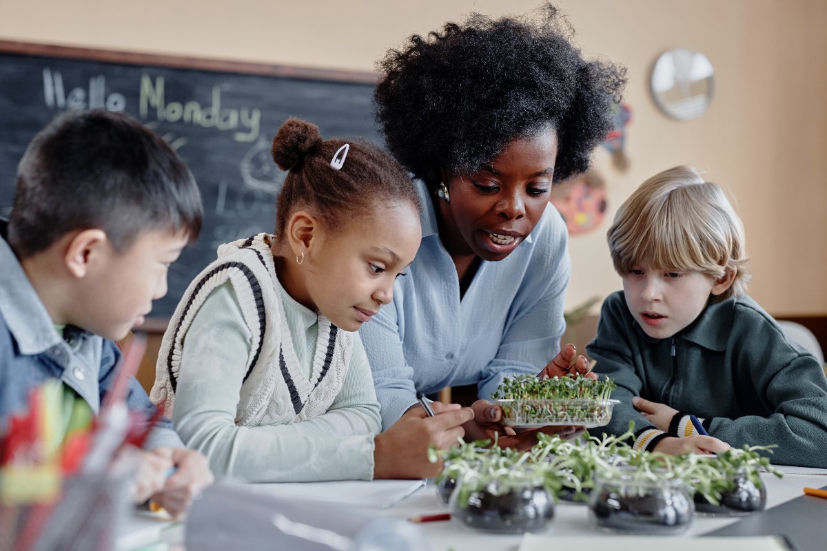 Teacher helping students.