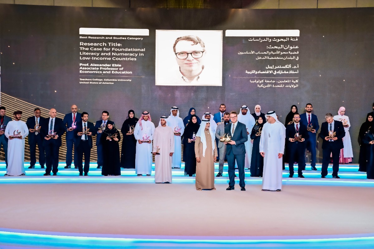 Pictured: Eble receiving the Khalifa Award.