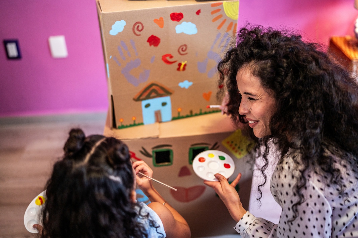 mom and daughter do an art project together
