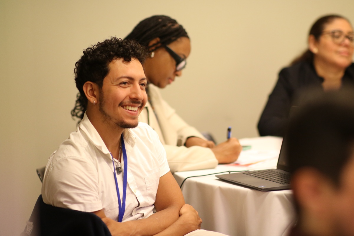 Participant smiles at the Hispanic Education Summit