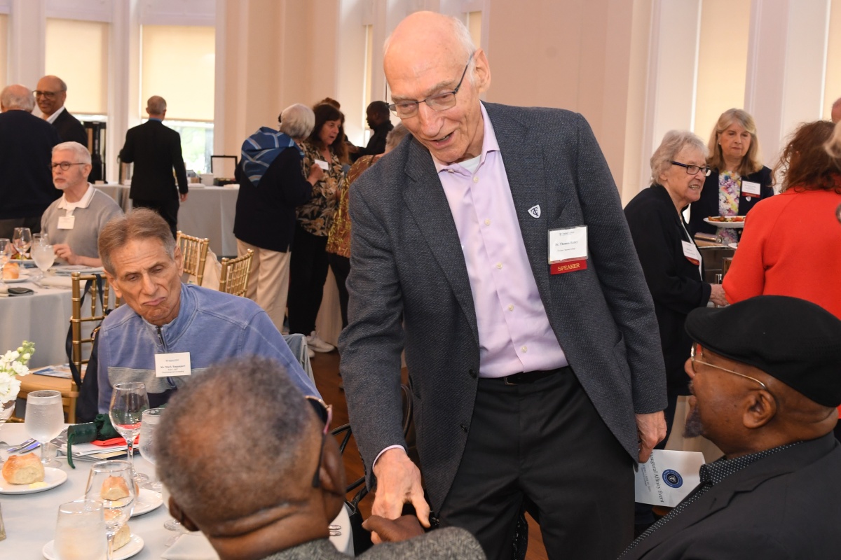 President Bailey shakes hands with guests at the Silver Roundtable