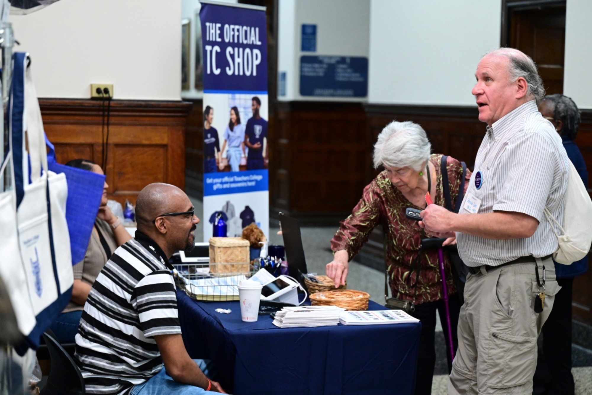 Guests purchase TC merch at the Silver Roundtable merch