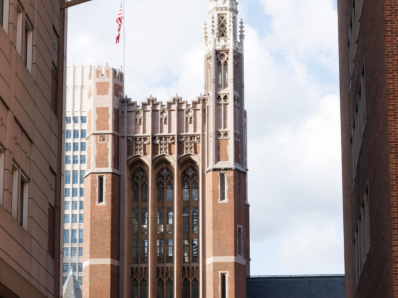 zoomed in view of Teachers College tower building with gothic style architechtural details