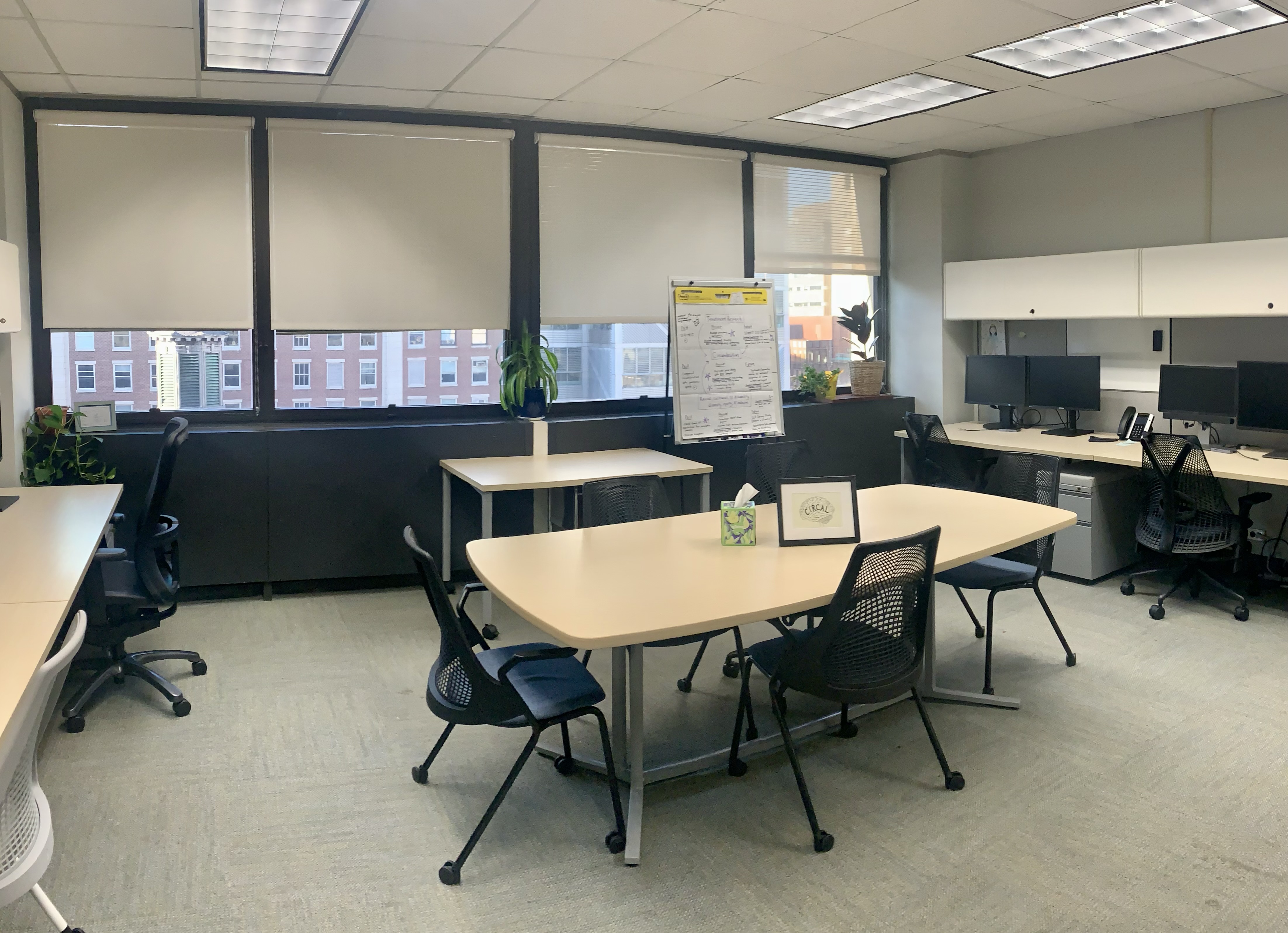 Research lab in Building 528, with tables, chairs, computers, plants